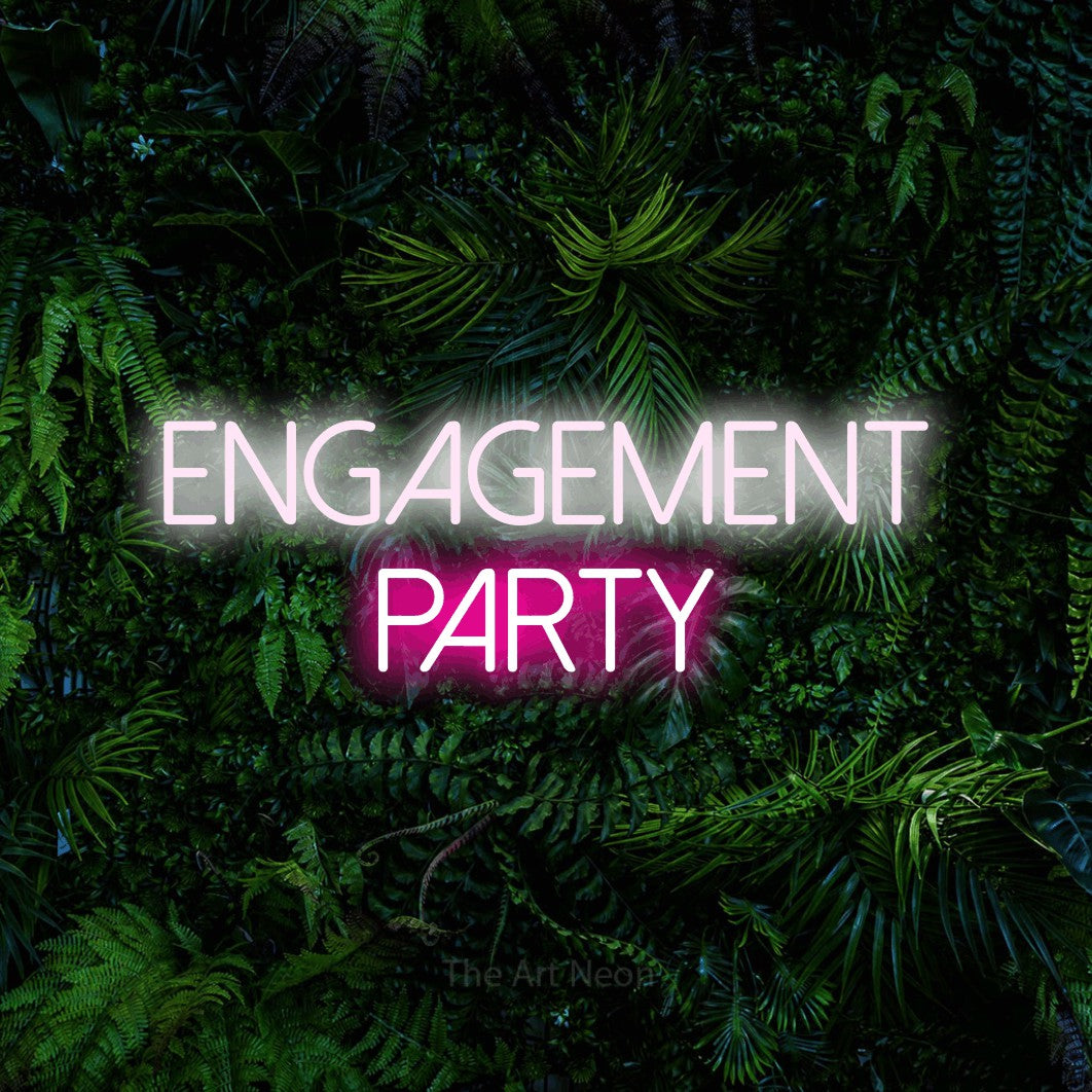 Hot pink and cool white LED neon sign reading "Engagement Party" against a dense tropical foliage wall for wedding décor