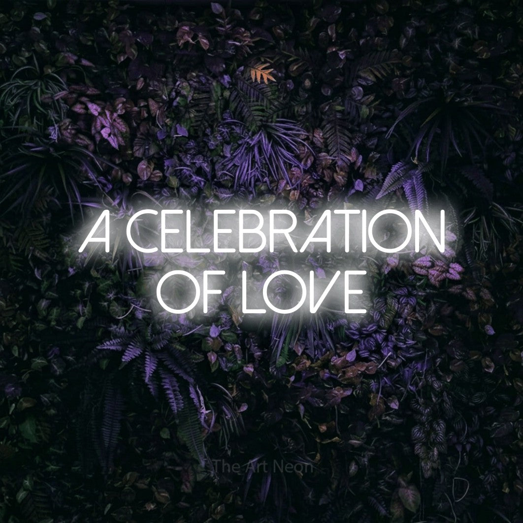 Cool white LED neon sign reading "A Celebration of Love" against a purple floral wall for wedding décor