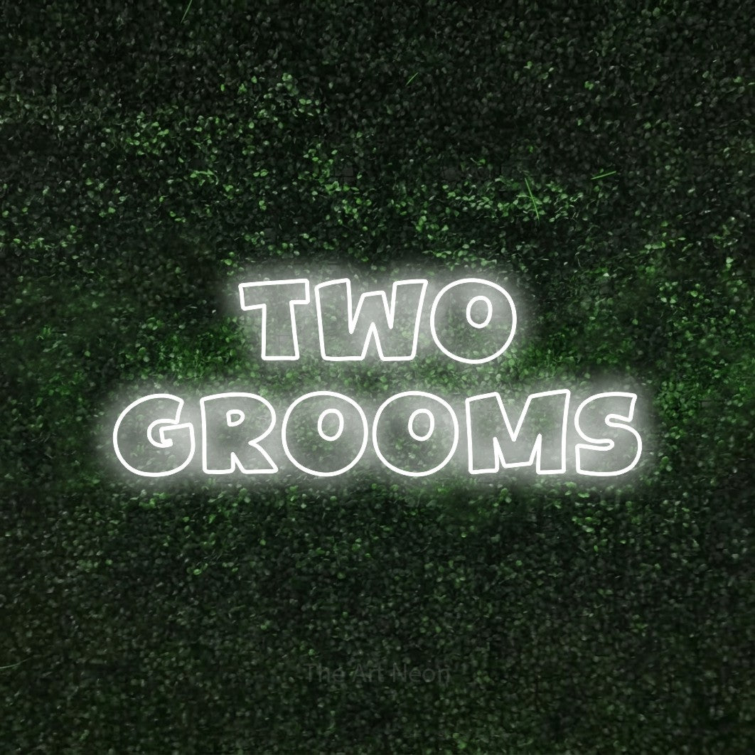 Cool white outline-style LED neon sign reading "Two Grooms" against a textured green moss wall for wedding décor