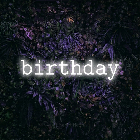 Cool white LED neon sign reading "Birthday" against a purple floral wall for party décor