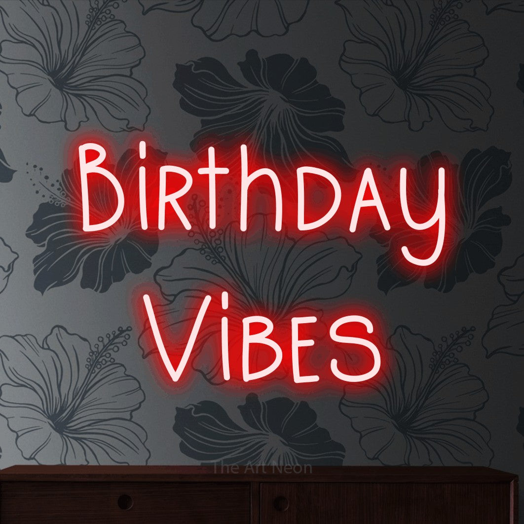 Red LED neon sign reading "Birthday Vibes" against grey floral wallpaper for party décor