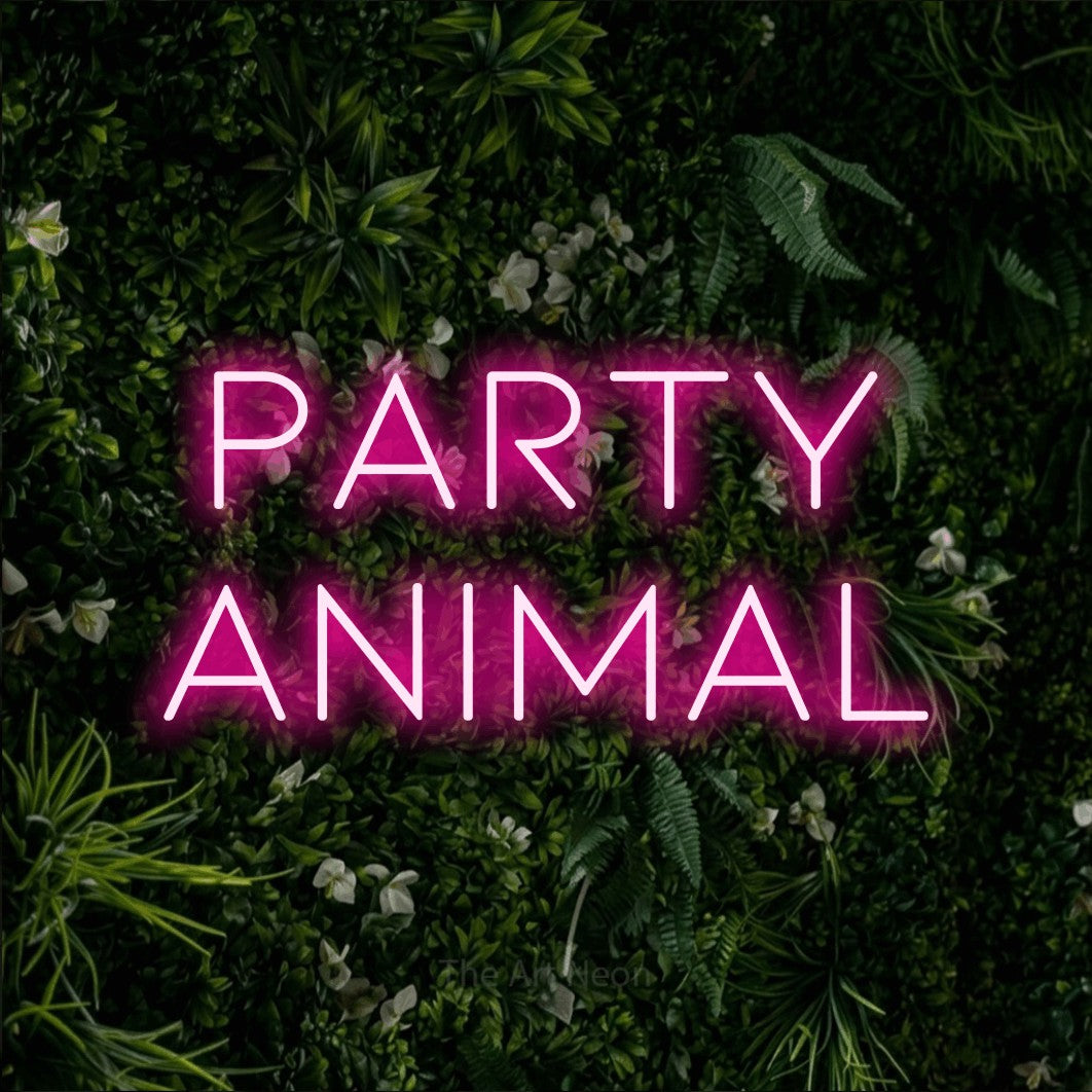 Hot pink LED neon sign reading "Party Animal" against a leafy green wall for party décor