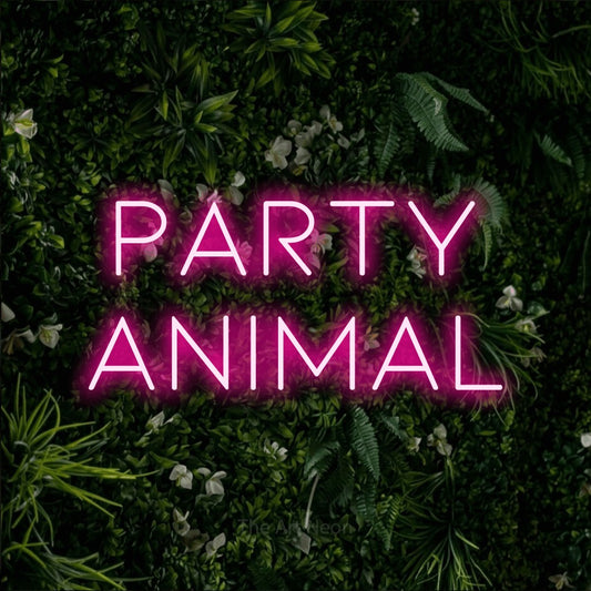 Hot pink LED neon sign reading "Party Animal" against a leafy green wall for party décor