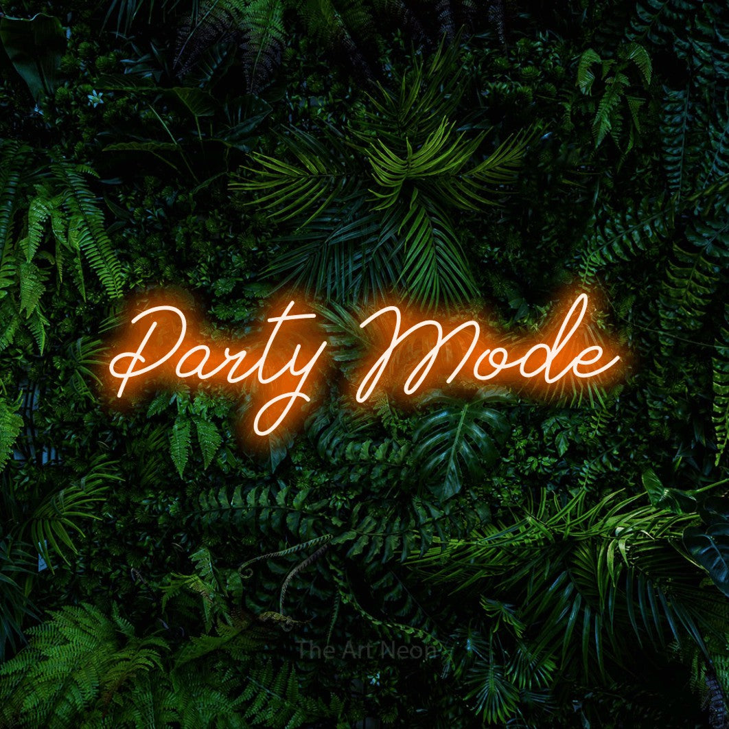 Orange script-style LED neon sign reading "Party Mode" against a dense tropical foliage wall for party décor