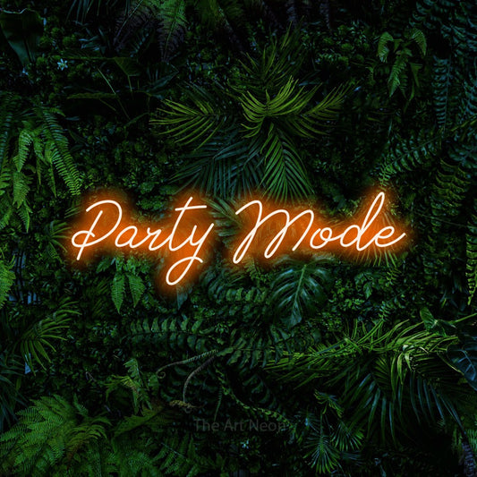 Orange script-style LED neon sign reading "Party Mode" against a dense tropical foliage wall for party décor