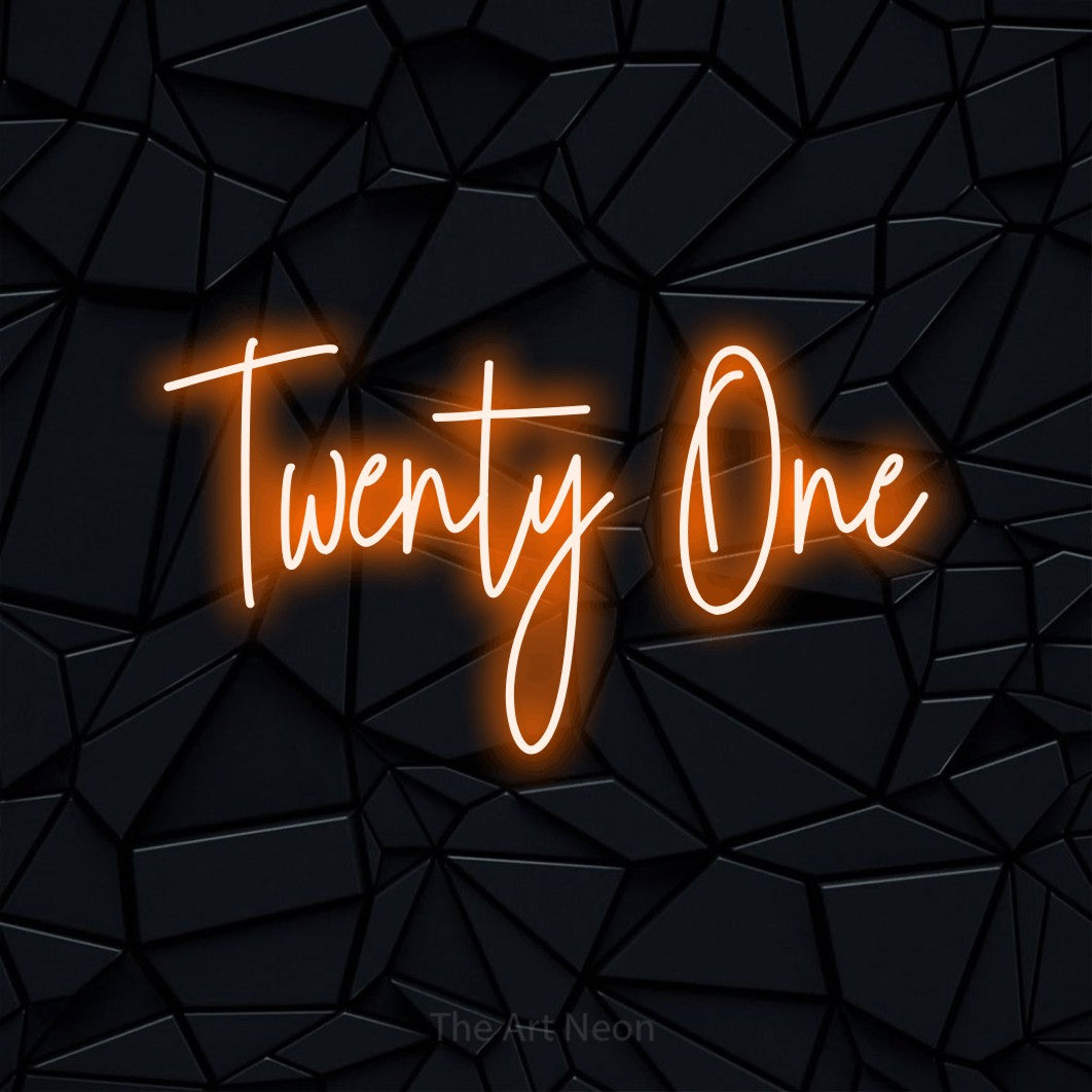 Orange script-style LED neon sign reading "Twenty One" against a black faceted wall for party décor