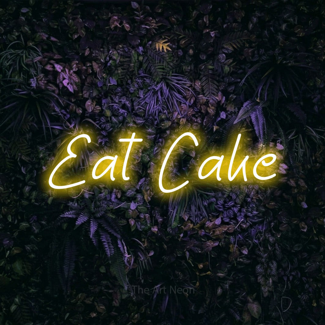 Yellow LED neon sign reading "Eat Cake" against a purple floral wall for party décor