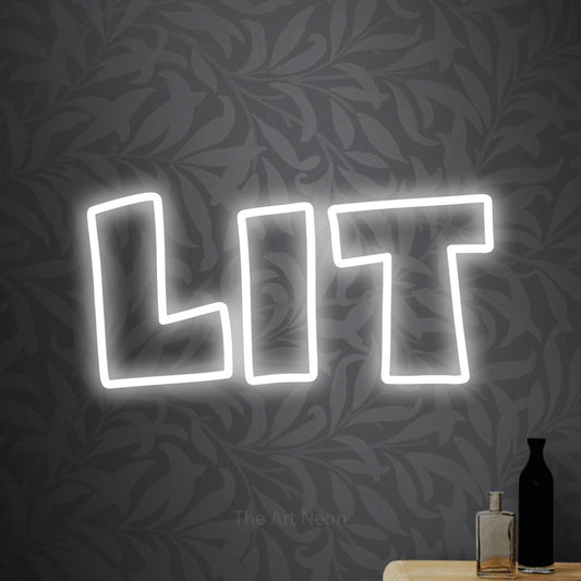 Cool white outline-style LED neon sign reading "Lit" against light grey floral wallpaper for party décor