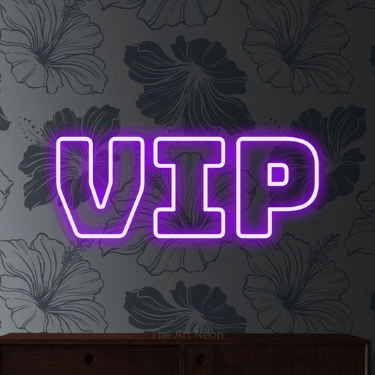 Purple outline-style LED neon sign reading "VIP" against grey floral wallpaper for party décor