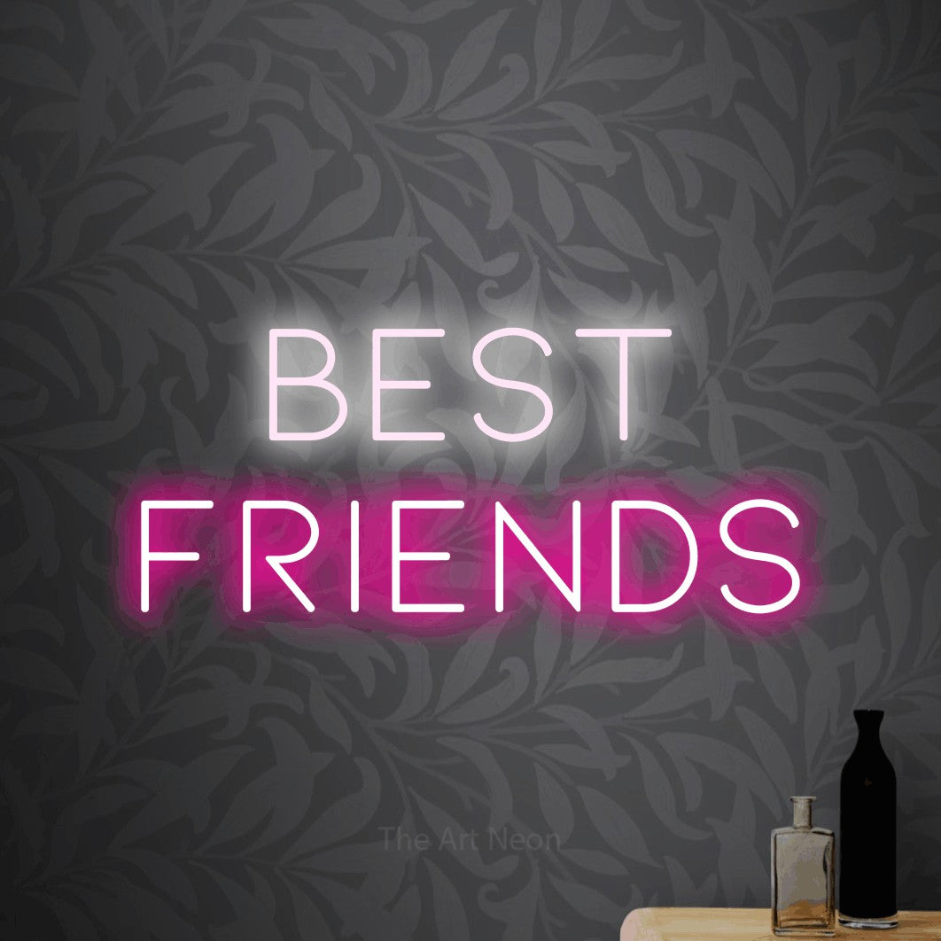 Hot pink and cool white LED neon sign reading "Best Friends" against light grey floral wallpaper for party décor