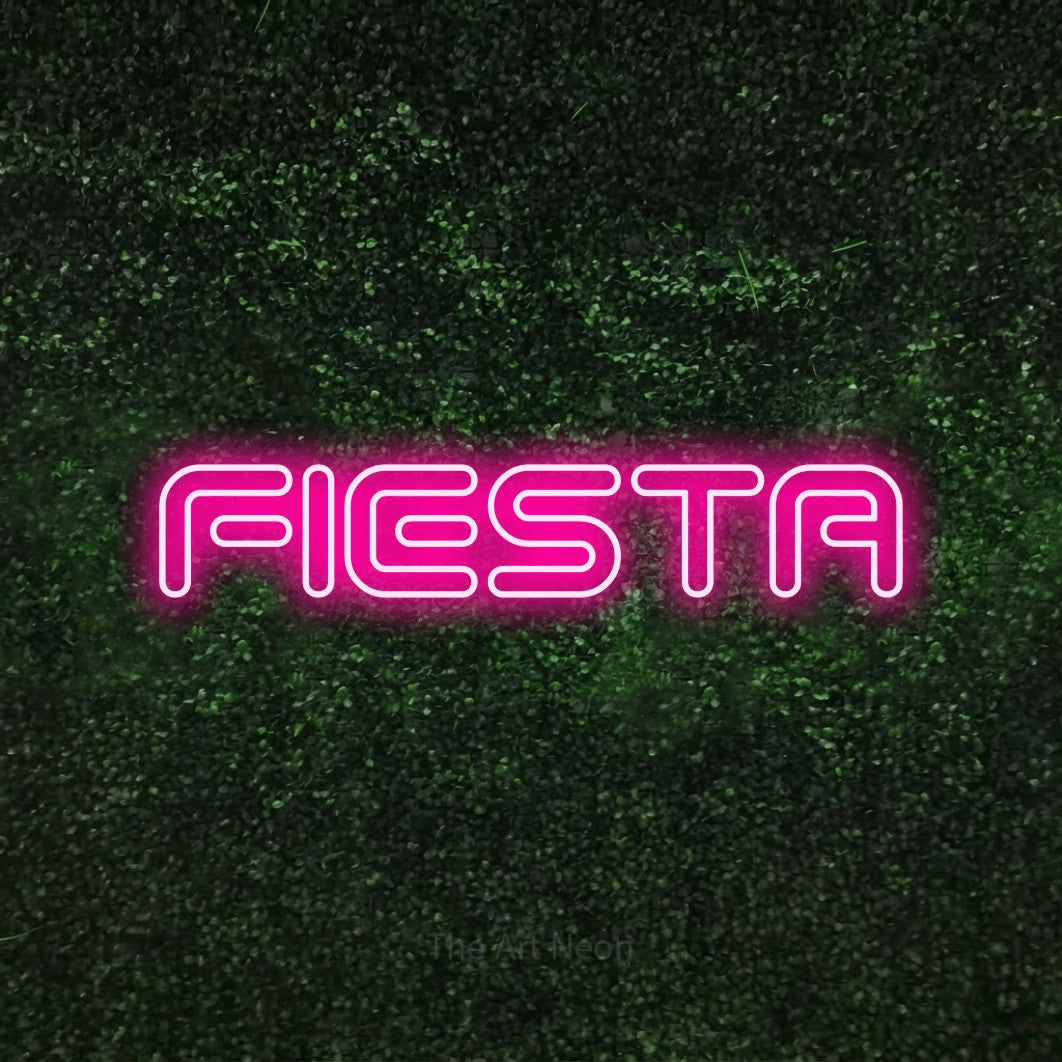 Hot pink outline-style LED neon sign reading "Fiesta" against a textured green moss wall for party décor