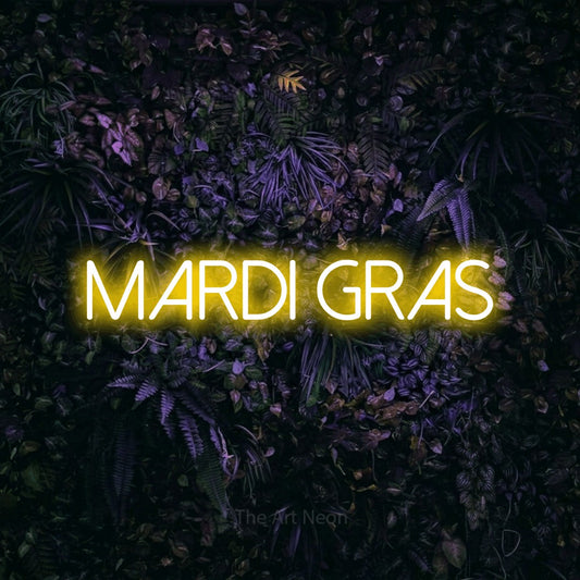 Yellow LED neon sign reading "Mardi Gras" against a purple floral wall for party décor