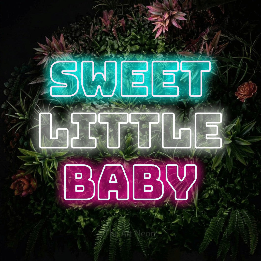 Multicolour outline-style LED neon sign reading "Sweet Little Baby" against a flowering garden wall