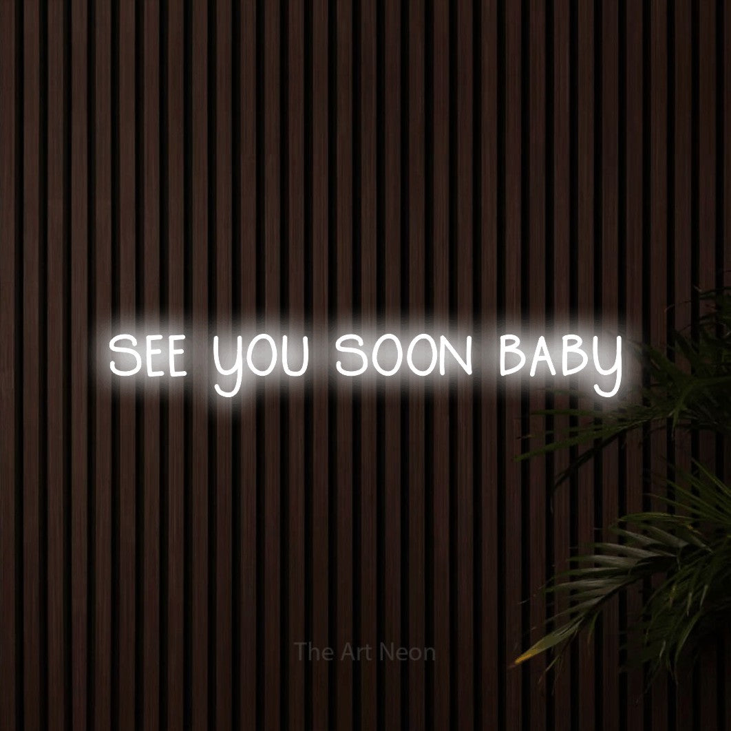 Cool white LED neon sign reading "See You Soon Baby" against dark wooden slats