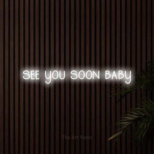 Cool white LED neon sign reading "See You Soon Baby" against dark wooden slats