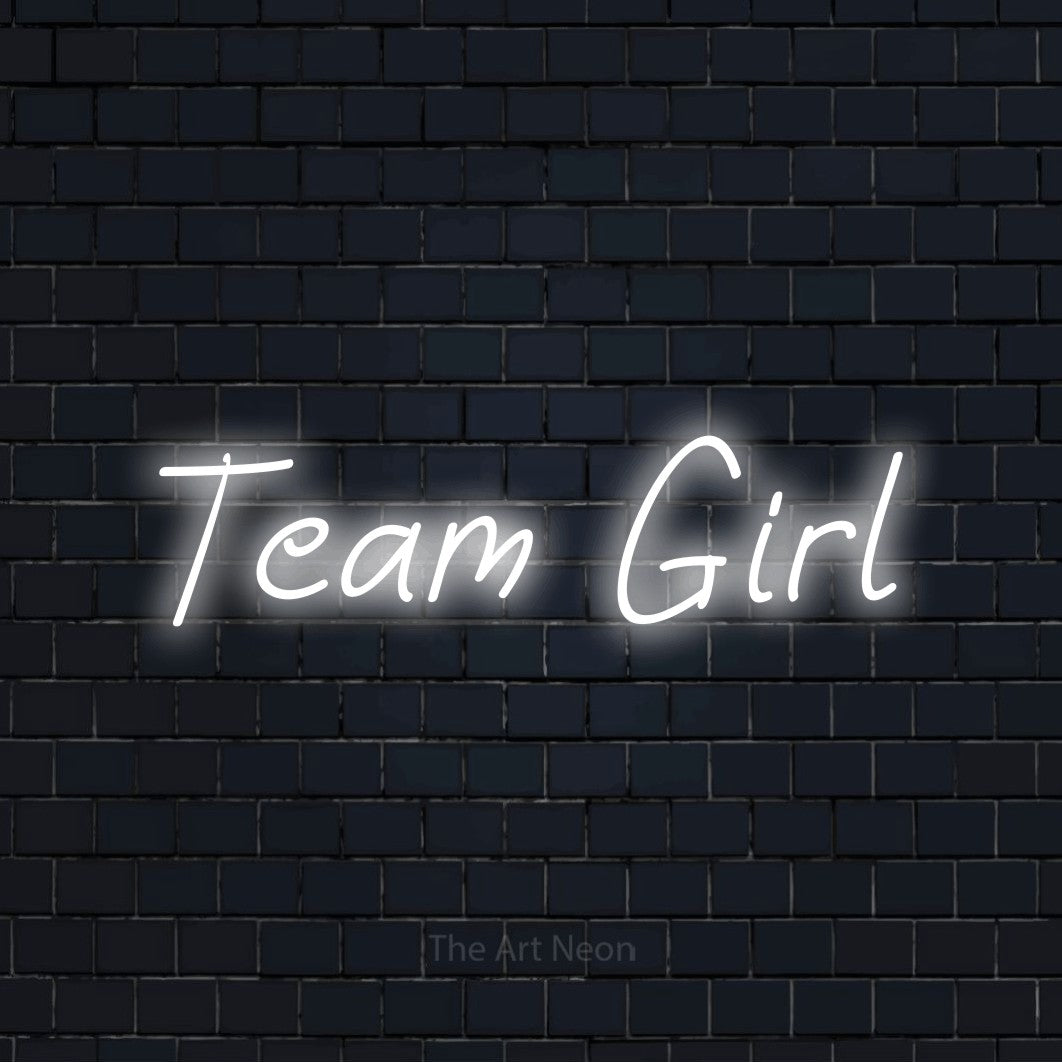 Cool white LED neon sign reading "Team Girl" against a dark navy brick wall