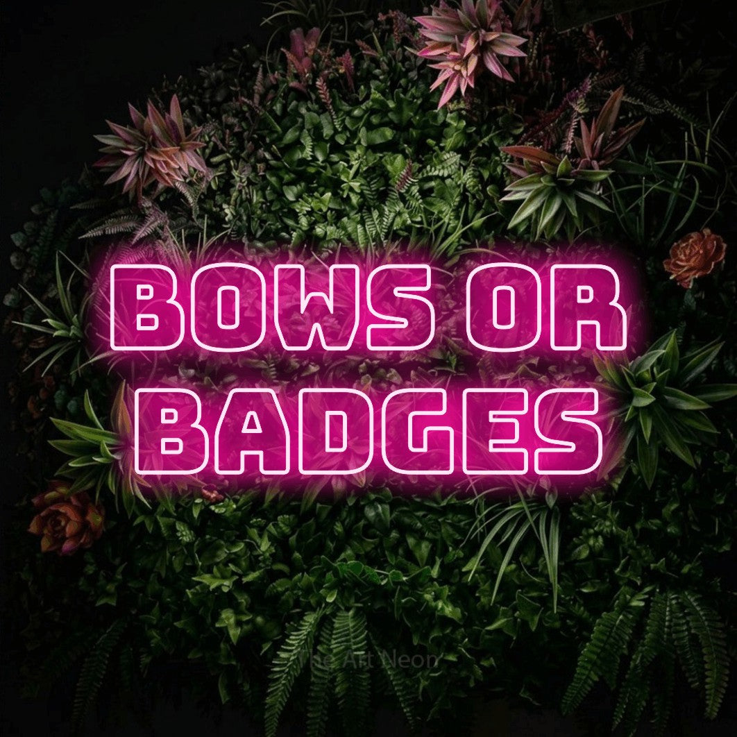 Hot pink outline-style LED neon sign reading "Bows or Badges" against a flowering garden wall