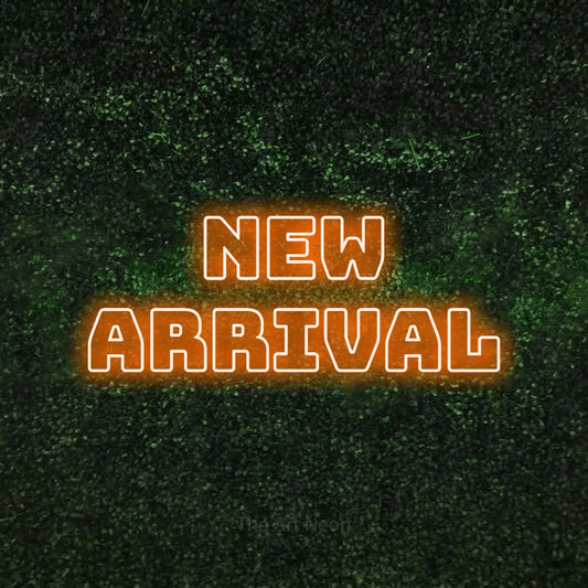 Orange outline-style LED neon sign reading "New Arrival" against a textured green moss wall