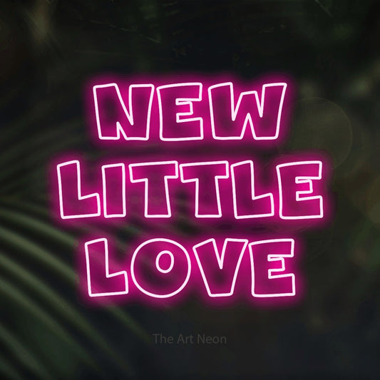 Hot pink outline-style LED neon sign reading "New Little Love" against dark blurred palm leaves