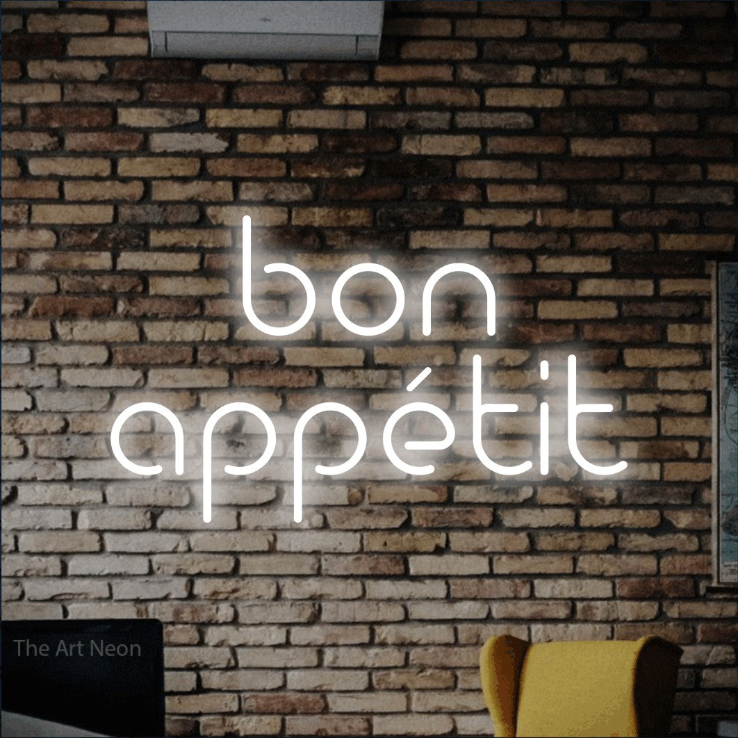 Cool white LED neon sign reading "Bon Appétit" against a rustic brick wall for restaurant décor