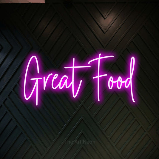 Pink script-style LED neon sign reading "Great Food" against a dark geometric wood wall for restaurant décor