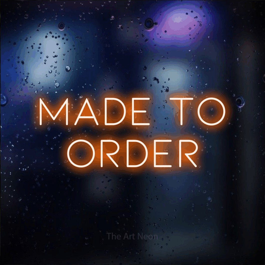 Orange LED neon sign reading "Made to Order" against a dark blue bokeh background for restaurant décor
