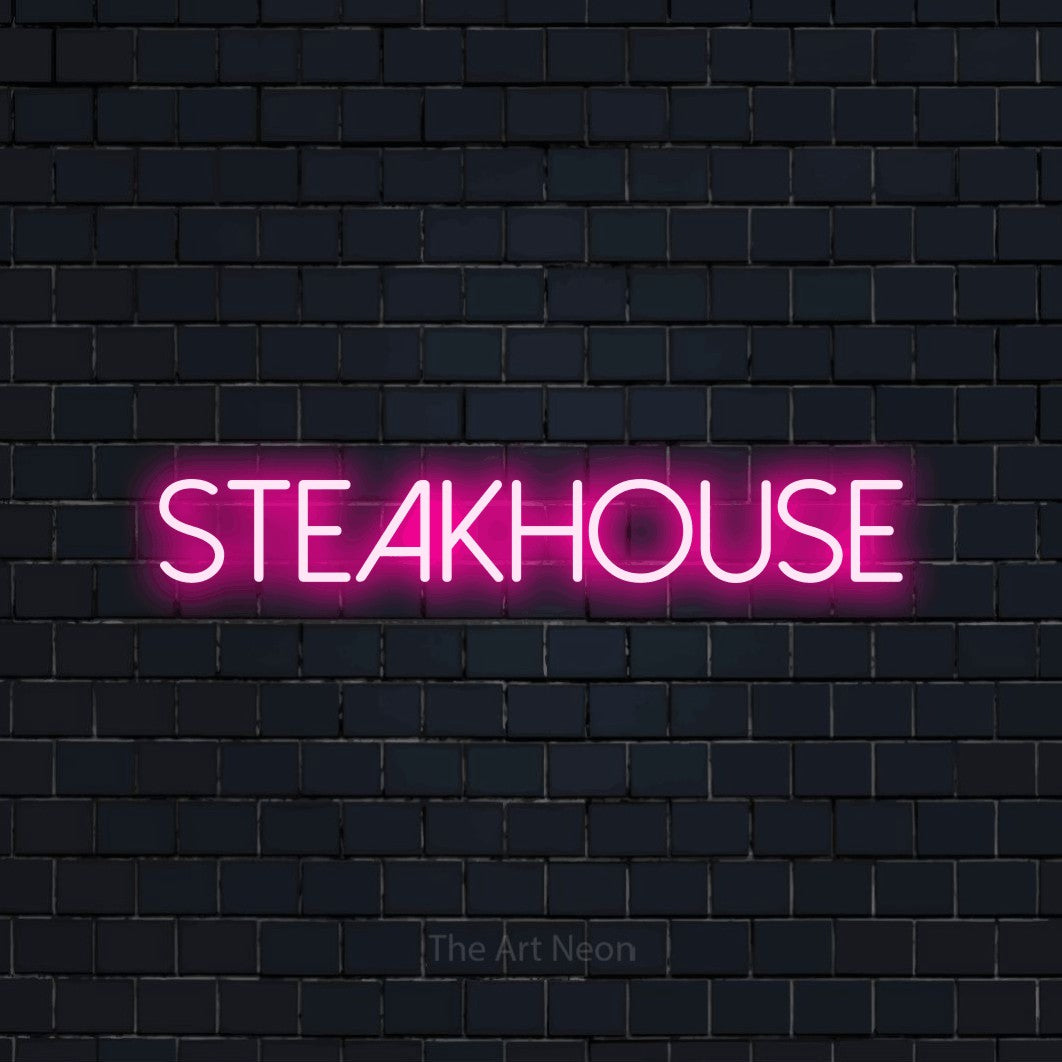 Hot pink LED neon sign reading "Steakhouse" against a dark navy brick wall for restaurant décor
