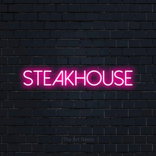 Hot pink LED neon sign reading "Steakhouse" against a dark navy brick wall for restaurant décor