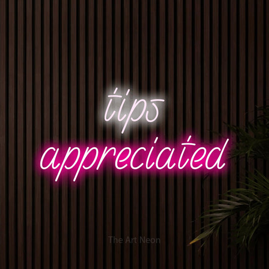 Hot pink and cool white LED neon sign reading "Tips Appreciated" against dark wooden slats for restaurant décor