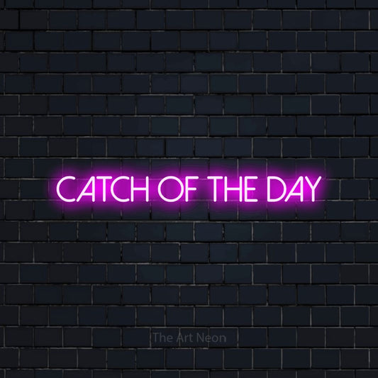 Pink LED neon sign reading "Catch of the Day" against a dark navy brick wall for restaurant décor