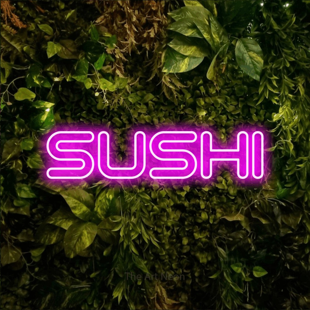 Pink outline-style LED neon sign reading "Sushi" against a textured moss and foliage wall for restaurant décor