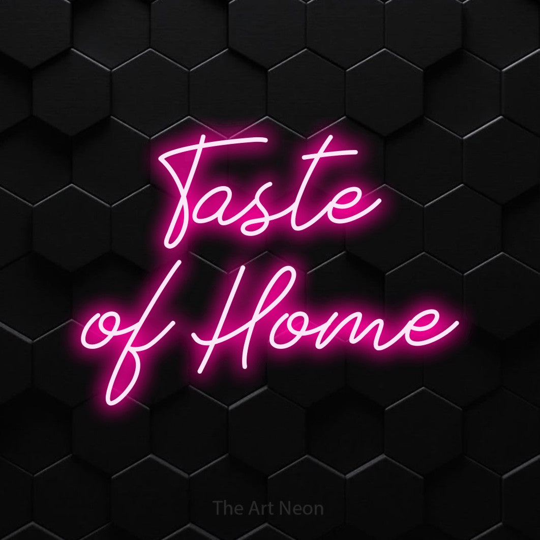 Hot pink script-style LED neon sign reading "Taste of Home" against a black hexagonal wall for restaurant décor