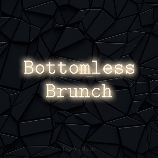 Warm white LED neon sign reading "Bottomless Brunch" against a black faceted wall for restaurant décor