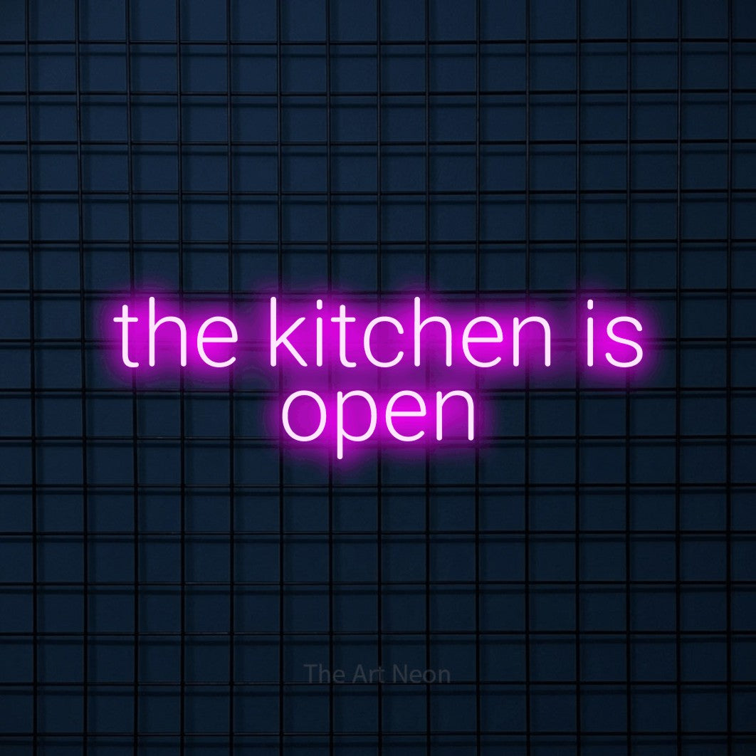 Pink LED neon sign reading "The Kitchen is Open" against a dark blue tiled wall for restaurant décor