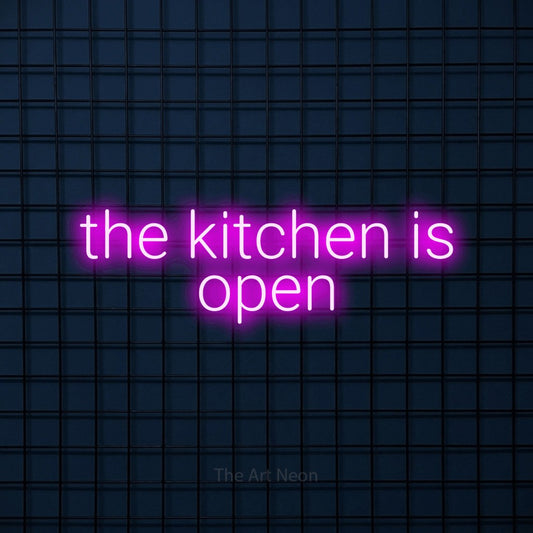 Pink LED neon sign reading "The Kitchen is Open" against a dark blue tiled wall for restaurant décor