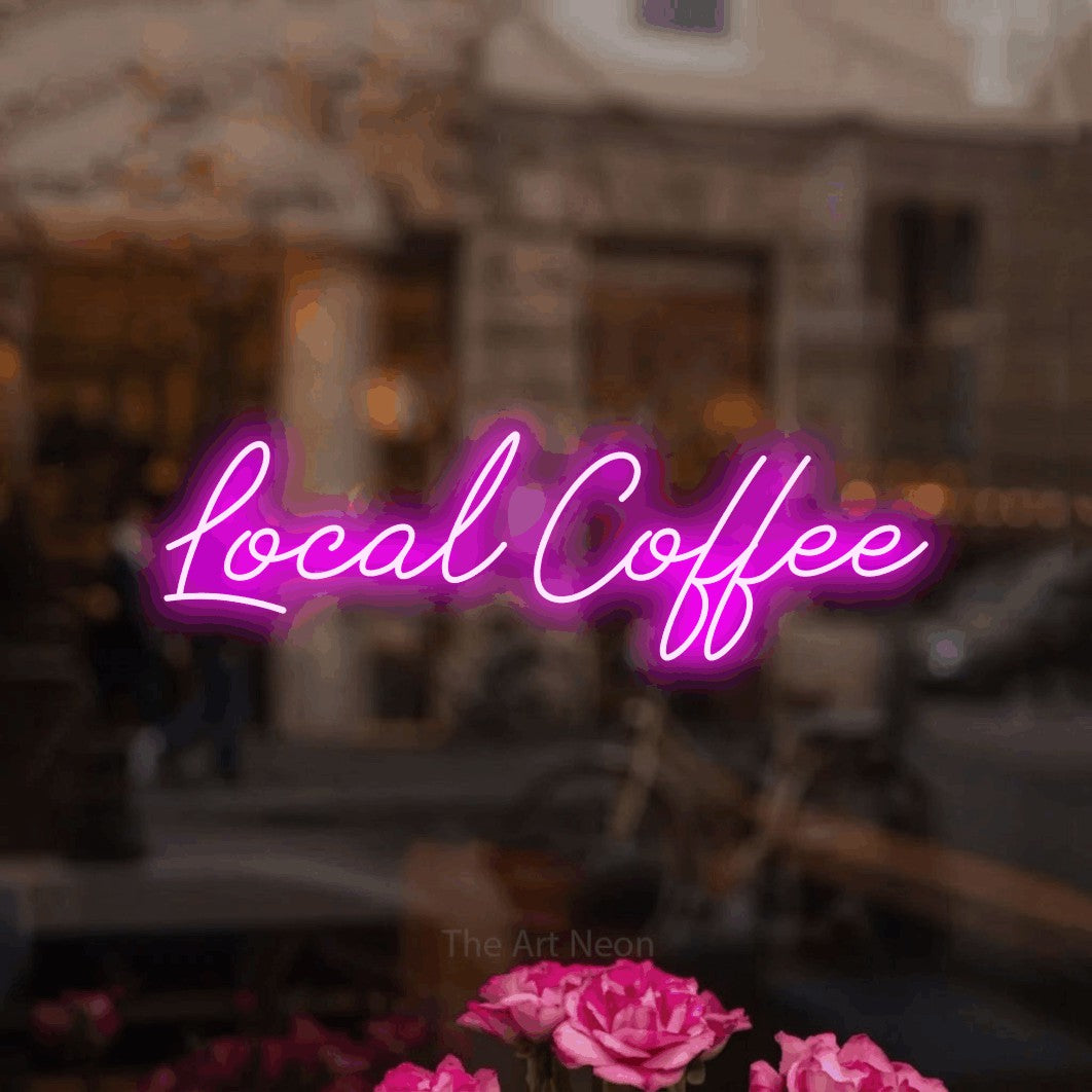 Pink script-style LED neon sign reading "Local Coffee" in a softly blurred café interior for café décor