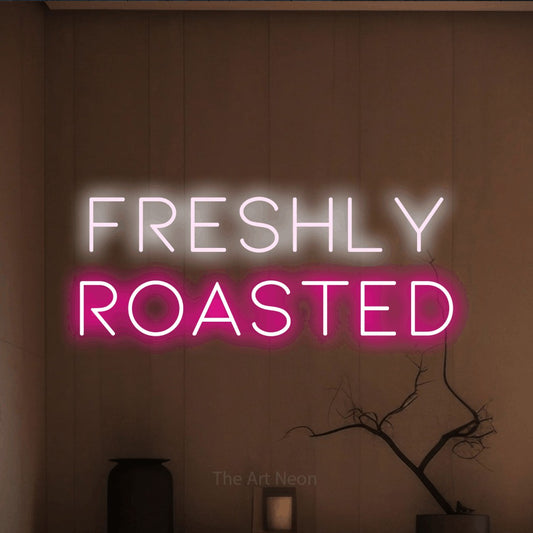 Hot pink and cool white LED neon sign reading "Freshly Roasted" against a warm brown wall for café décor