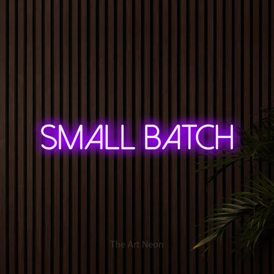Purple LED neon sign reading "Small Batch" against dark wooden slats for café décor