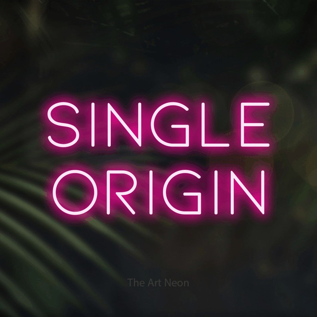 Hot pink LED neon sign reading "Single Origin" against dark blurred palm leaves for café décor
