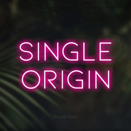 Hot pink LED neon sign reading "Single Origin" against dark blurred palm leaves for café décor