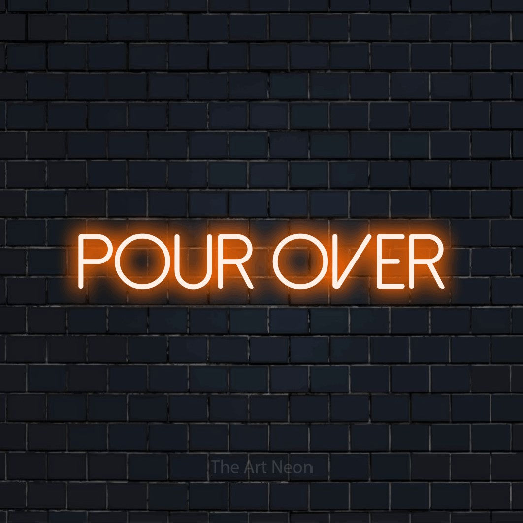 Orange LED neon sign reading "Pour Over" against a dark navy brick wall for café décor