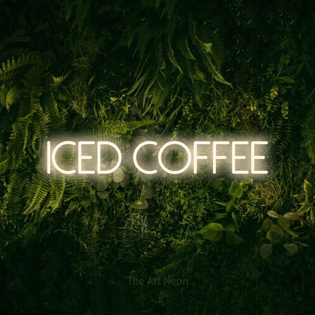 Warm white LED neon sign reading "Iced Coffee" against a moss-covered green wall for café décor