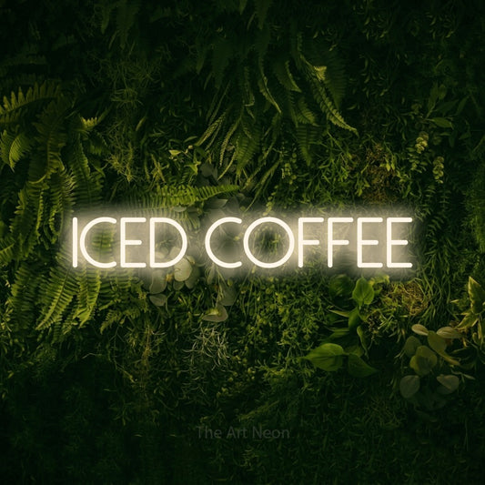 Warm white LED neon sign reading "Iced Coffee" against a moss-covered green wall for café décor
