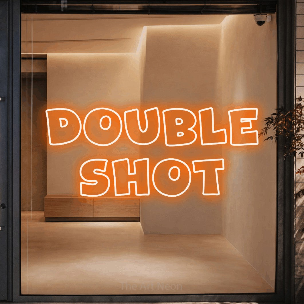 Orange outline-style LED neon sign reading "Double Shot" against a warm beige alcove wall for café décor
