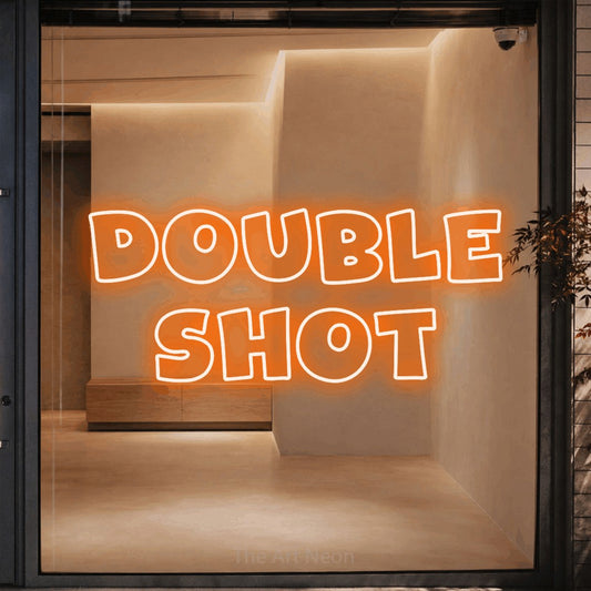 Orange outline-style LED neon sign reading "Double Shot" against a warm beige alcove wall for café décor
