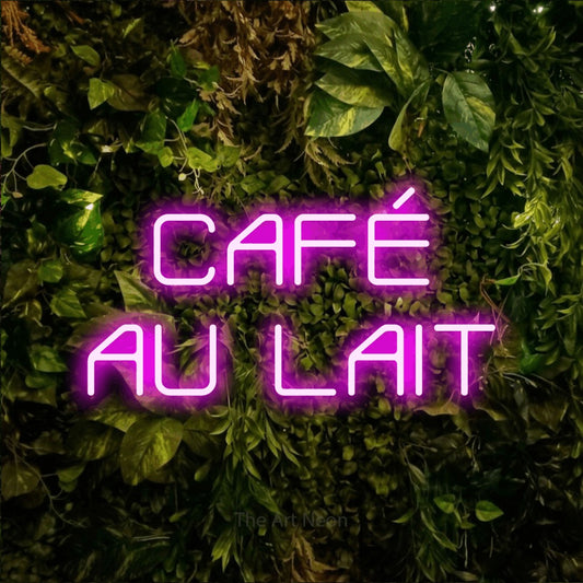 Pink LED neon sign reading "Café au Lait" against a textured moss and foliage wall for café décor