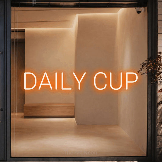 Orange LED neon sign reading "Daily Cup" against a warm beige alcove wall for café décor