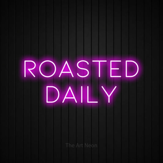 Pink LED neon sign reading "Roasted Daily" against a black vertical slat wall for café décor