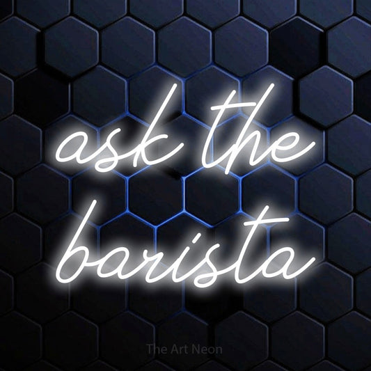 Cool white script-style LED neon sign reading "Ask the Barista" against a blue hexagonal wall for café décor