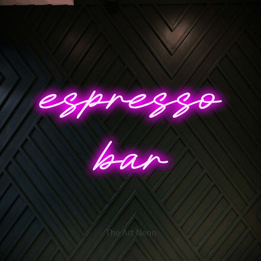 Pink LED neon sign reading "Espresso Bar" against a dark geometric wood wall for café décor